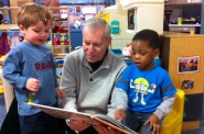 Bill Bravener reading to children. Photo courtesy of the Penfield Children's Center.