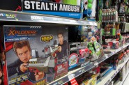 An aisle at a local toy store is devoted to guns and other weapons for young boys. (Photo by Teran Powell)