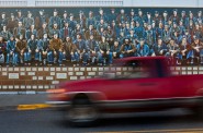 In Hurley, Wis., a truck passes a mural depicting iron ore miners in July 2012. Some residents of Iron and Ashland counties residents hoped a planned iron ore mine would bring more than 700 jobs to the area, but Gogebic Taconite pulled its plan in February 2015. Photo by Lukas Keapproth of the Wisconsin Center for Investigative Journalism.