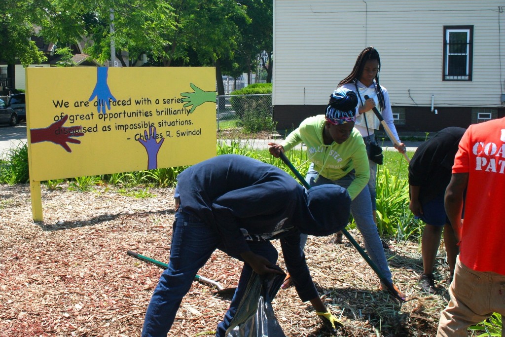Cleveland Easley and other students work at a pocket park on 19th Street and Meinecke Avenue. Photo by Jabril Faraj.