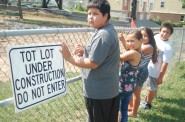 Neighborhood children anxiously await the reopening of Arlington Heights Park, 3429 W. Pierce St. Photo by Edgar Mendez.