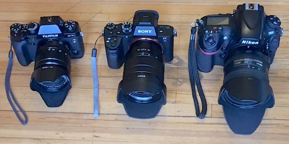 Fuji X-T1 with XF18-55 f/2.8-4, Sony A7rII with FE 24-70 f4, Nikon D800 with Nikkor 24-85 f/2.8-4D IF. You can see the Fuji, a crop sensor camera, is the smallest of the bunch, but the Sony is pretty close. I use the medium zoon lenses for almost everything I shoot while on the bike.