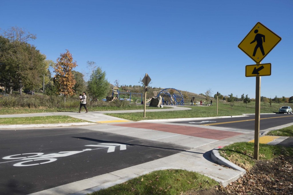 The Menomonie River Parkway reconstruction included traffic calming like this neck-down and raised crosswalk to slow motor vehicles and make it safer for people to cross the road.