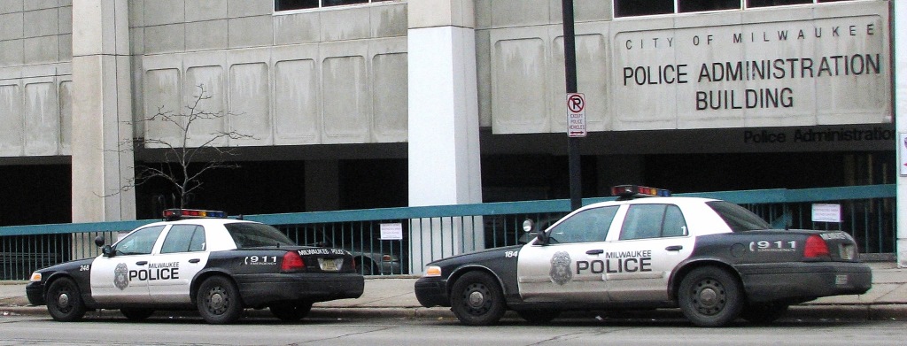 Milwaukee Police Department squad cars parked in front of the department’s administration building. Photo by Brendan O’Brien.