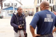 Mario Sinclair interviews Darin Jones near the Milwaukee Public Museum, across from the firehouse where he works. Photo by Emmy Spring.