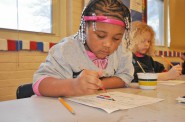 Four-year-old kindergarten students paint with watercolors. Photo courtesy of MPS.