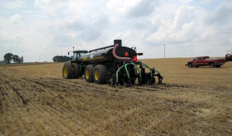 Manure is spread during a demonstration. Photo by Carolyn Betz of the University of Wisconsin Sea Grant Institute.