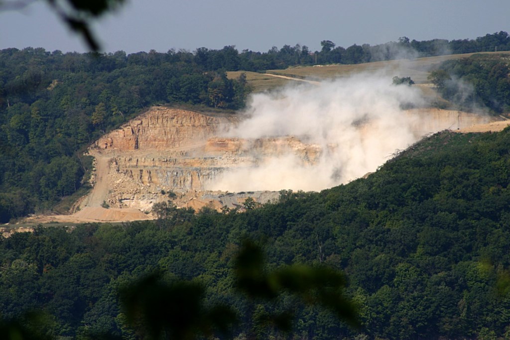 A blasting operation at Pattison Sand Co.'s surface mine in Iowa is seen on Sept. 14, 2015, from across the Mississippi River in Bagley, Wis. Homeowners Jim and Kathy Kachel say dust from the mine has gotten inside of their home. Photo courtesy of Jim Kachel.