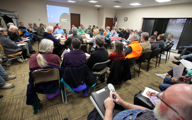 The Mine Reserve Expansion Study Committee meets in the Clayton County office building in Elkader, Iowa, on April 28. The committee was formed to determine the environmental, economic and aesthetic impacts of Pattison Sand’s proposed mine expansion. More than 60 people attended the meeting, where two experts on air quality from the University of Iowa spoke. Photo Coburn by Dukehart of the Wisconsin Center for Investigative Journalism.