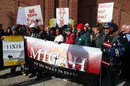 Demonstrators march in front of the Milwaukee Secure Detention Facility, 1015 N. 10th St., during an event to launch WISDOM’s campaign to end mass incarceration in Wisconsin. Photo by Barbara Pfarr.