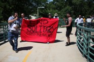 Chance Zombor, 36, leads a protest against the practice of solitary confinement at a rally in Madison Tuesday. Zombor has spent time in isolation at Waupun and Oshkosh correctional institutions. About 30 people marched to the Wisconsin Department of Corrections headquarters to deliver a letter arguing against the use of solitary confinement in Wisconsin prisons. Along the way they shouted "Our passion for freedom is stronger than their prisons!" Photo by Coburn Dukehart of the Wisconsin Center for Investigative Journalism.