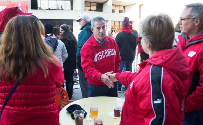 Former U.S. Sen. Russ Feingold works the crowd at Union South before the start of the Badger football game against the Purdue Boilermakers, Oct. 17, 2015 at Camp Randall Stadium. Feingold, a Democrat, is trying to regain the U.S. Senate seat he lost to Republican Ron Johnson six years ago. Photo by Steve Apps of the Wisconsin State Journal.