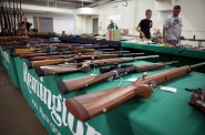 Rifles are seen on display at Ron Martin's booth at the Badger Military Collectible Show in Waukesha, on Aug. 5. Martin has been a licensed gun dealer for 33 years. Photo by Coburn Dukehart of the Wisconsin Center for Investigative Journalism.