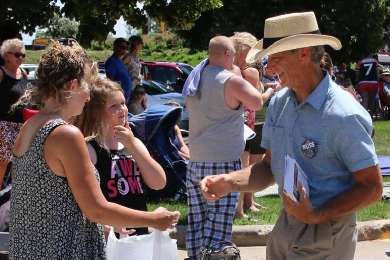 Organic farmer Russ Brown, who is challenging Rep. Scott Krug, R-Nekoosa, campaigns in Wisconsin Rapids during the Cranberry Blossom Festival Parade on June 19. Brown, a Democrat, and Krug agree water quality and quantity are key issues in the race for the 72nd Assembly District seat. Photo courtesy of Russ Brown.