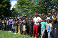 Black men and boys lock arms at the event. Photo by Jabril Faraj.