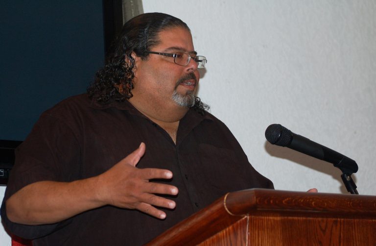 Robert Miranda, a representatives of Freshwater for Life Action Coalition (FLAC), warned residents about elevated lead levels in their household water during a recent public meeting. Photo by Edgar Mendez.