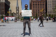 Oskar Mosco, 35, traveled from Santa Barbara, Calif., to protest in front of the Republican National Convention in Cleveland in July. Voters in 20 states, including Wisconsin, will face additional requirements and restrictions to vote, passed since the last presidential election in 2012, including presenting specific forms of identification at the polls. Photo by Emily Mahoney of News21.