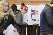 Eligible students cast their ballots for the presidential election and several state offices while voting at a polling place at Gordon Dining and Events Center at the University of Wisconsin-Madison on Nov. 6, 2012. Wisconsin's on-again off-again voter ID law will require students to present a photo ID to vote in the Nov. 8 election. Photo by Jeff Miller of the University of Wisconsin-Madison.