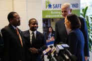 (From left) Ald. Ashanti Hamilton, Ald. Cavalier Johnson, Mayor Tom Barrett and Safe & Sound Executive Director Katie Sanders gather after the news conference to announce Safe & Sound’s expansion into District 4 neighborhoods. Photo by Allison Steines.