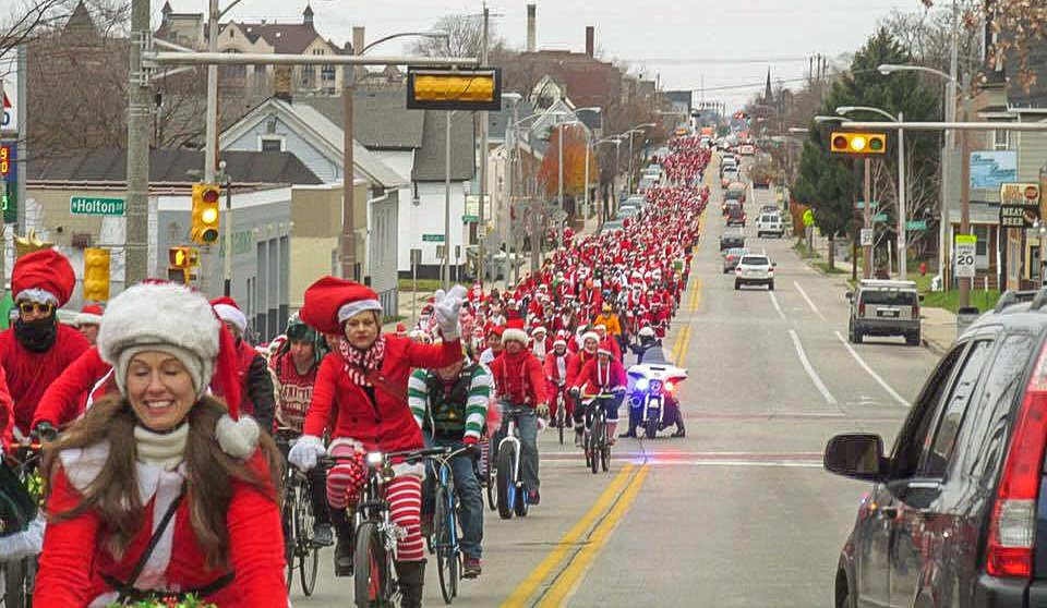 How many were there? We don’t have an exact count, but that is a whole lot of Santas! This photo, taken looking west from Booth Street, shows the sea of Santas stretching at least 12 blocks west to Dr. Martin Luther King Drive.
