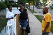 Anita Aydin (left) and Shawn Hudson (center) talk with Shawn Moore on N. 25th Street. Photo by Jabril Faraj.