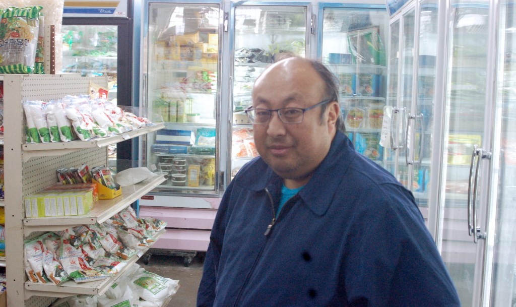 Asian market General Manager Thai Vang says his store offers a variety of unique products. Photo by Dean Bibens.