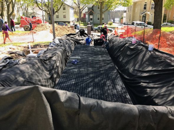 An enormous tarp is laid out to hold the 7,000-gallon cistern. Photo Courtesy of Arts @ Large.