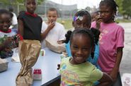 Kids enjoy a free meal program provided by the Milwaukee Summer Food Service program. Photo courtesy of Hunger Task Force.