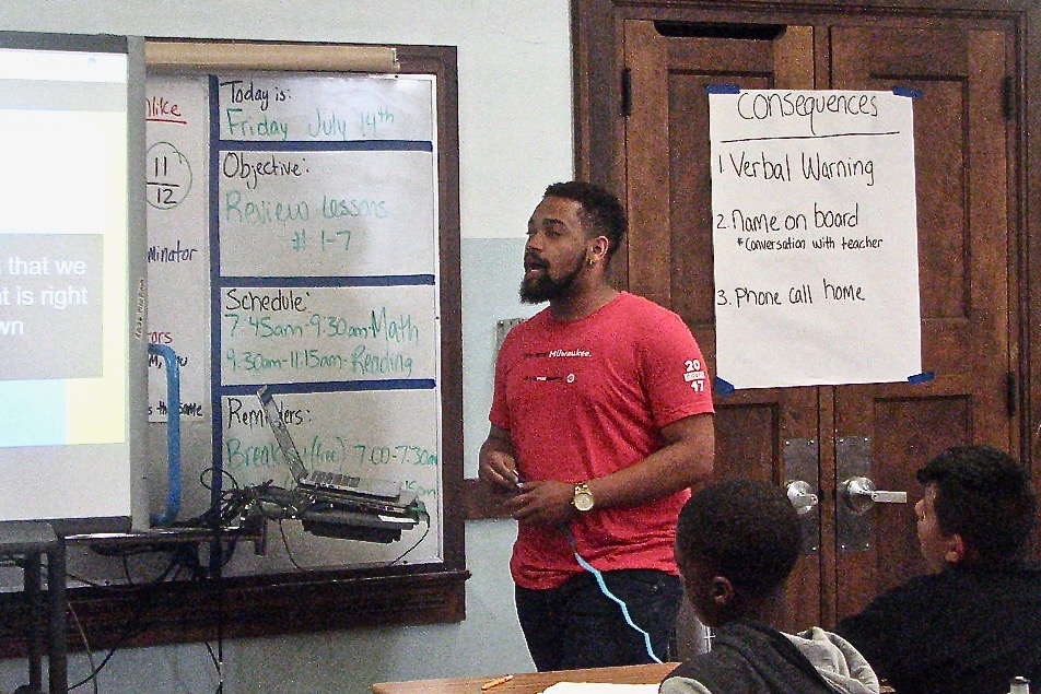 Reginald Kirby, Teach for America corps member, teaches an English class at Greenfield Elementary. Photo by Lydia Slattery.