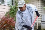 Gloria Lee helps with landscaping as Revitalize Milwaukee volunteers repair her home. Photo by Leah Harris.