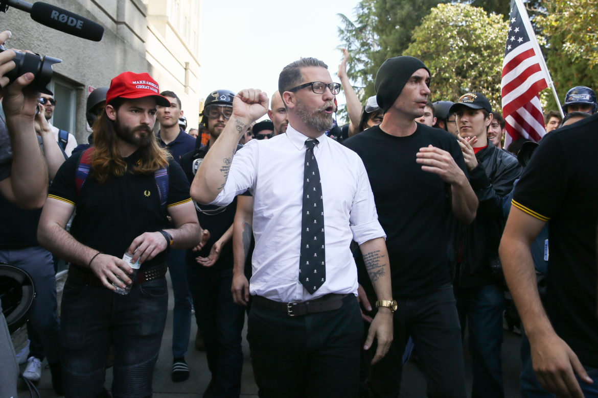 Proud Boys founder Gavin McInnes pumps his fist during a rally at Martin Luther King Jr. Civic Center Park on April 27, 2017 in Berkeley, Calif. Protesters marched in opposition to the cancellation of a speech by American conservative political commentator Ann Coulter at the University of California-Berkeley. Photo by Elijah Nouvelage/Getty Images.