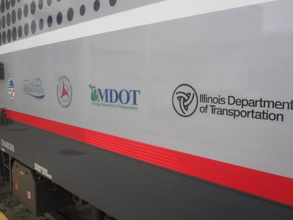 The logos of each of the state agencies in the consortium accompanies those of Amtrak and of the American Recovery Act on the sides of the locomotives. Photo by Michael Horne.