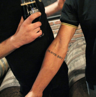 Eric, president of the Wisconsin chapter of the Proud Boys, shows off his tattoo, which is part of initiation into the group. Another ritual involves getting punched by other members while reciting breakfast cereal names. Photo taken Oct. 4, 2017. Photo by Alexandra Hall / WPR/Wisconsin Center for Investigative Journalism.