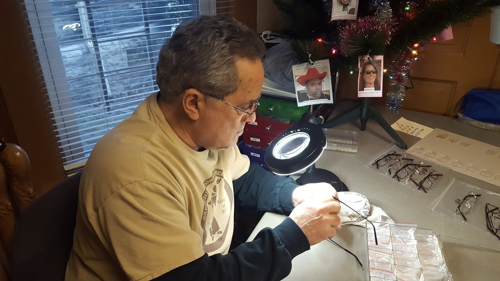 Chuck at his desk preparing eyeglasses for guests. Photo courtesy of the Nonprofit Center of Milwaukee.
