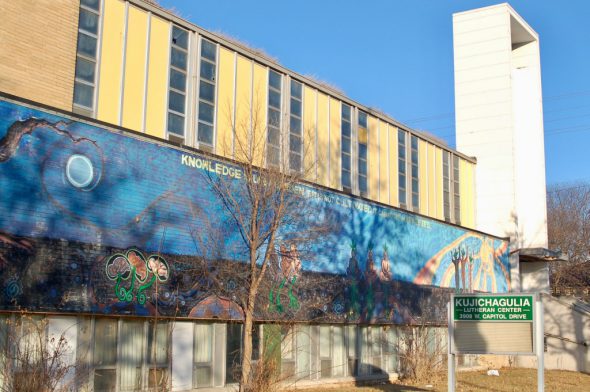 Kujichagulia Lutheran Center, adorned with a mural by Ammar Nsoroma called “Knowledge is Like a Garden,” has stood vacant and in need of rehabilitation for more than a decade. Photo by Andrea Waxman.
