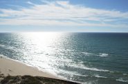 East coast of Lake Michigan looking west from Big Sable Point lighthouse. Photo is in the Public Domain.
