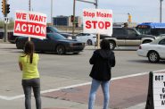 Community members stand at the intersection for hours at a time urging drivers to slow down and be safe. Photo by Sophie Bolich.