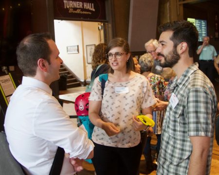 Caitlin Taylor (center) and Tony Giron (right) chat with another attendee at the Jane’s Walk MKE event, “Seeding Grassroots.” Photo courtesy of Dominic Inouye, Jane’s Walk MKE.