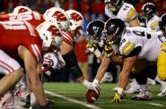 Interviews with more than a dozen current and former Badger football players reveal that many downplay the threat of brain injury, even though some said they have had their “bell rung” many times. Here, the Badgers’ play against Iowa on Nov. 11, 2017, in Madison. Dee Warmath, assistant professor and principal research scientist in the School of Human Ecology, is leading a study that tests different forms of concussion education on club sport athletes at UW — many of whom do not receive the same level of information about concussions. Photo by Brad Horn/For the Wisconsin Center for Investigative Journalism.
