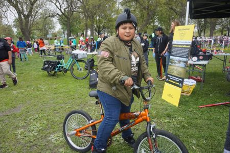 Alejandro Gespaida, 10, poses with his new bike and helmet. Photo by Donna Sarkar..