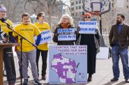 Marla Stephens, center, and Kris Lennon, center right, attend Maps Madness: Voters vs. Politicians, a March 7, 2018 rally organized by the Wisconsin Fair Maps Coalition held outside the Wisconsin state Capitol. The rally was aimed at pressuring lawmakers to hold a special session to enact a nonpartisan redistricting system. Stephens, a former candidate for state Supreme Court justice, says she believes her vote has been diluted by redistricting in the Milwaukee area. Photo by Cameron Smith/Wisconsin Center for Investigative Journalism.