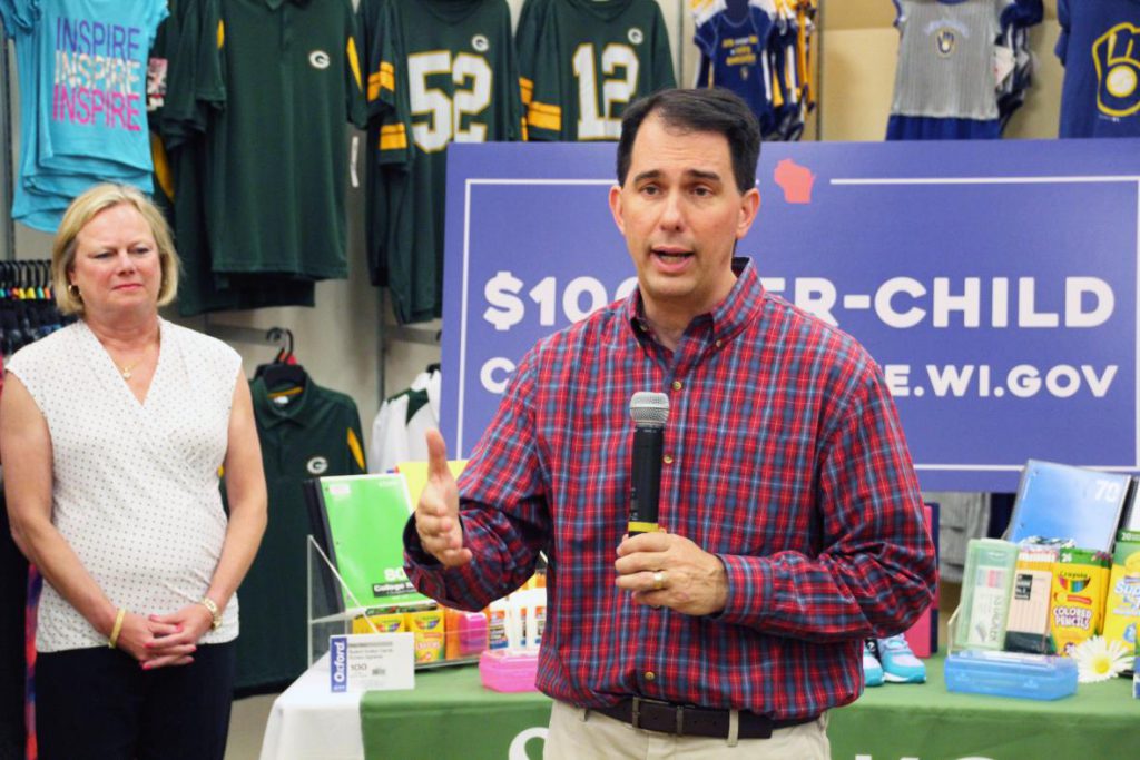 Gov. Scott Walker promotes the state's child tax credit during a stop in Sussex. Shawn Johnson/WPR