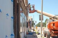 Construction workers renovate the exterior of Pete’s Pops, which is set to open Aug. 11th. Photo by Jenny Whidden.