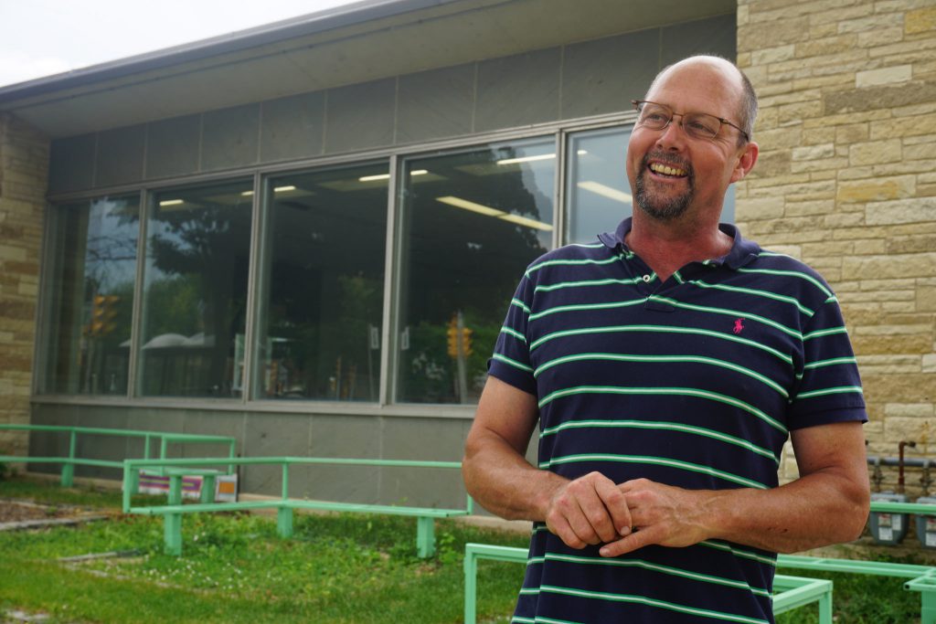 Matt Bohlmann stands outside the former Finney Library, which he purchased from the city in 2015. Photo by Abby Ng.