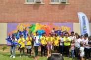 Youth from Express Yourself MKE unveil their new mural at Running Rebels Community Organization. Photo by Zach Komassa.