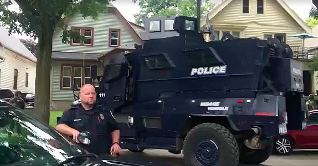 An armored vehicle is parked outside a residence on North 33rd Street. Photo by Gab Taylor via ComForce/NNS.