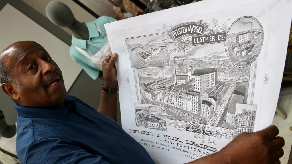 Clayborn Benson displays a drawing of the tanneries once operated by the Pfister and Vogel Leather Co. on display at the museum. Photo by Max Nawara/NNS.