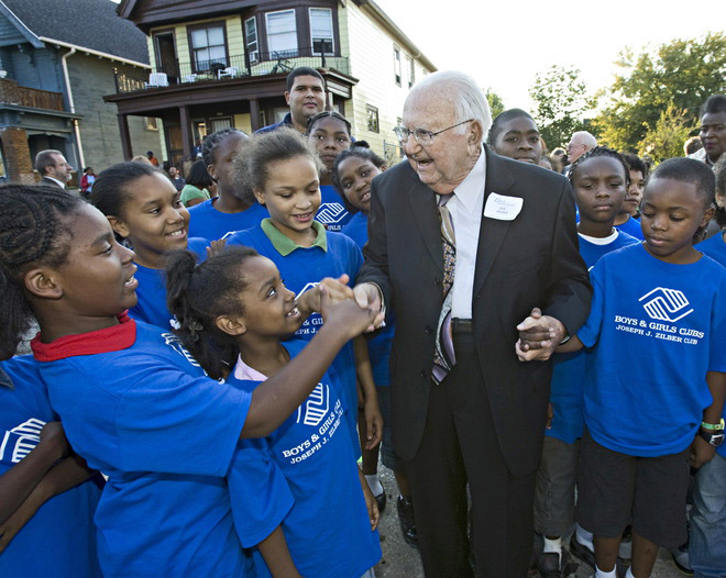 Joe Zilber gets a warm welcome from members of the Joseph J. Zilber Boys and Girls Club in September 2008 when he announced the Zilber Neighborhood Initiative grant at Walnut Way. Photo by Michael Sears courtesy of the Zilber Family Foundation.