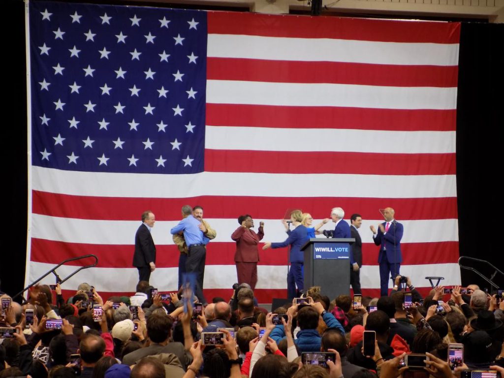Obama appeared on stage with other Democratic candidates at Milwaukee rally on Friday. Photo by Ximena Conde/WPR.