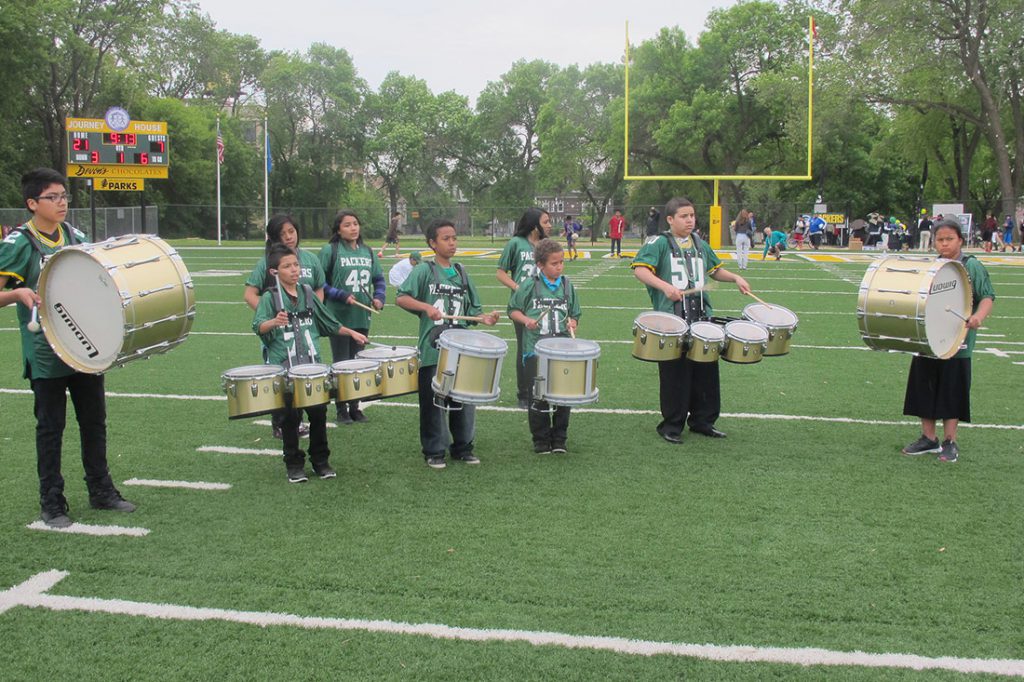 A marching band plays at the opening celebration of the Journey House Packers Field at Mitchell Park in spring 2013. Photo by Edgar Mendez/NNS.